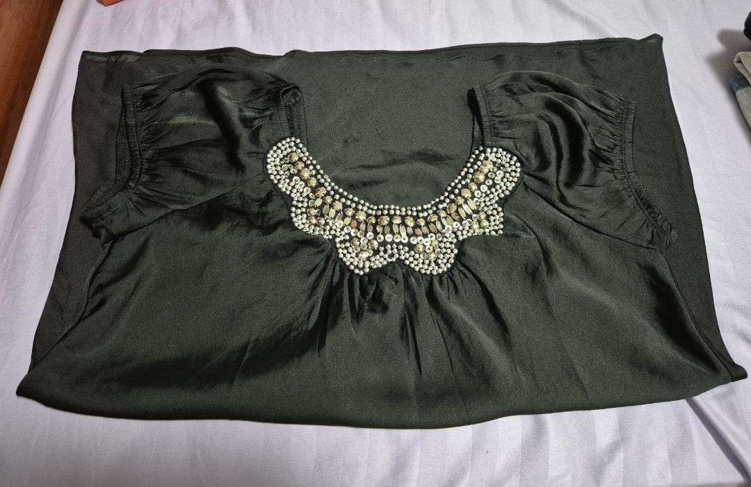 Black Short Sleeve Blouse with silver beads (Category: Dresses) located in Manila. Submitted by sorayabarr50152 (Listing ID 1461739816, Image 3). Description: - Elegant black short sleeve dress - Stunning neckline adorned with beads and crystals - Fabric with a subtle sheen - Comfortable fit with short puff sleeves - Ideal for night outs and special occasions.
