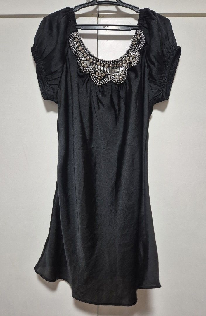 Black Short Sleeve Blouse with silver beads (Category: Dresses) located in Manila. Submitted by sorayabarr50152 (Listing ID 1461739816, Image 1). Description: - Elegant black short sleeve dress - Stunning neckline adorned with beads and crystals - Fabric with a subtle sheen - Comfortable fit with short puff sleeves - Ideal for night outs and special occasions.