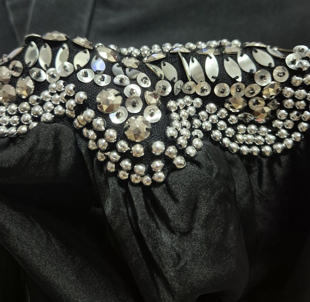 Black Short Sleeve Blouse with silver beads (Category: Dresses) located in Manila. Submitted by sorayabarr50152 (Listing ID 1461739816, Image 2). Description: - Elegant black short sleeve dress - Stunning neckline adorned with beads and crystals - Fabric with a subtle sheen - Comfortable fit with short puff sleeves - Ideal for night outs and special occasions.