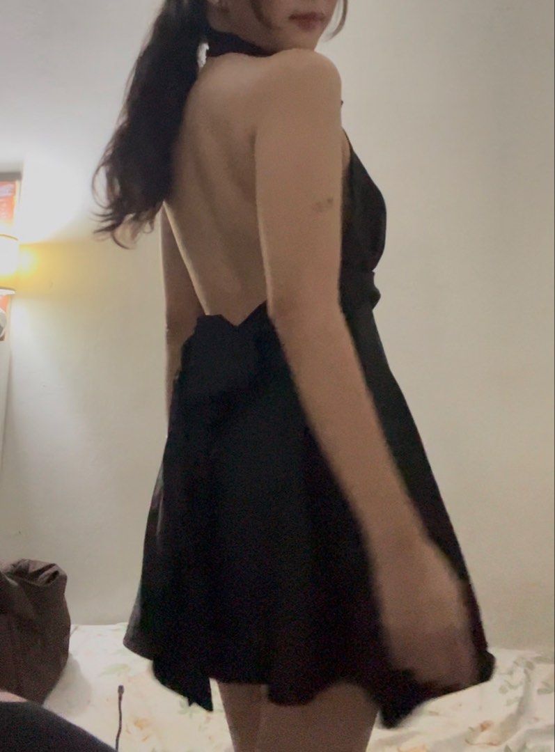 black halter neck backless dress (Category: Dresses) located in Quezon City. Submitted by leibear (Listing ID 1461568781, Image 2). Description: - satin - backless - has big straps na u tie at the back/side - size medium, true to size - i’m 5’2” & size 28 for reference - bought from tiktok shop for 648 - used once at a cocktail party.