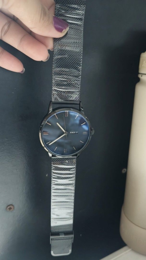 Black Mesh Strap Watch with Blue Dial (Category: Men's Watches) located in Taguig. Submitted by mercyeugen28914 (Listing ID 1461737883, Image 2). Description: - Minimalist black watch - Striking blue dial - Convenient day and date display - Adjustable black mesh metal strap with magnetic clasp - Modern and sleek design - Versatile for everyday or formal wear.
