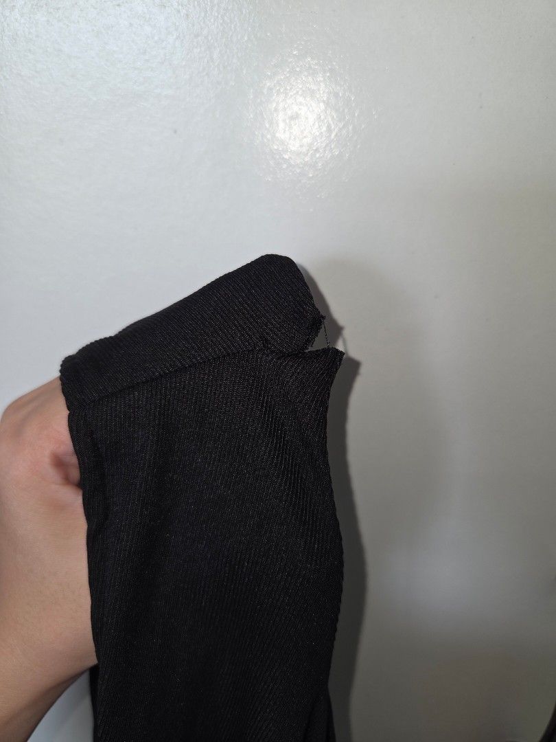 Black Mini Dress (Category: Dresses) located in Agdangan. Submitted by wearitnext.shop (Listing ID 1461562625, Image 3). Description: Square neckline, sleeveless black mini dress with a voluminous, pleated bubble-style skirt. Slight damage on the sleeves. Original Price: 409.