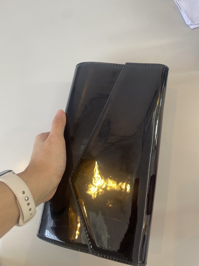 Black Patent Envelope Clutch Bag with Chain Strap (Category: Clutches) located in Cabanatuan. Submitted by maggiesdeclutterings (Listing ID 1461569002, Image 2). Description: - Sleek black patent envelope clutch - Detachable silver chain strap for versatile wear (crossbody/shoulder) - Interior zip pocket and card slots - Ideal for nights out and special occasions.