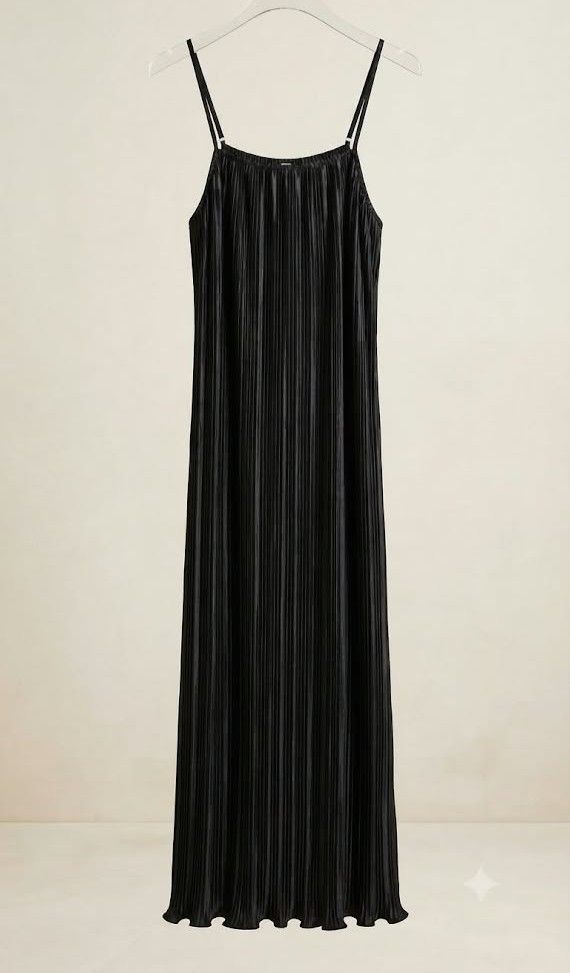 Plus Size Black Pleated Dress (Category: Dresses) located in Manila. Submitted by sorayabarr50152 (Listing ID 1461743604, Image 1). Description: - Flowy black maxi dress - Elegant pleated design - Delicate spaghetti straps - Fabric with a subtle sheen - Perfect for dressing up or down - Chic and sophisticated look.