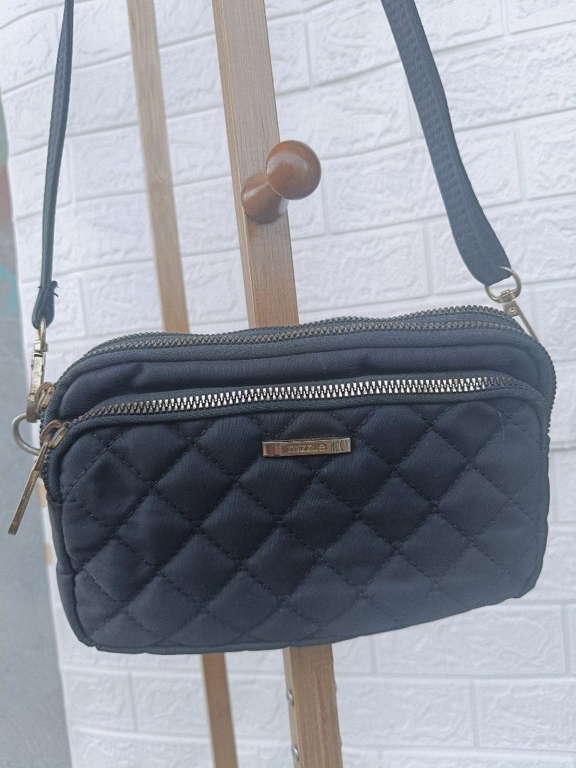 Black Quilted Crossbody Bag with Multiple Zippers (Category: Cross-body Bags) located in Cavite. Submitted by j_creations18 (Listing ID 1461580947, Image 1). Description: - Stylish black quilted crossbody bag - Multiple zippered compartments for organization - Adjustable strap for comfortable wear - Tarnished gold-tone hardware details - Ideal for everyday use or travel - Fits your phone, wallet, and keys .