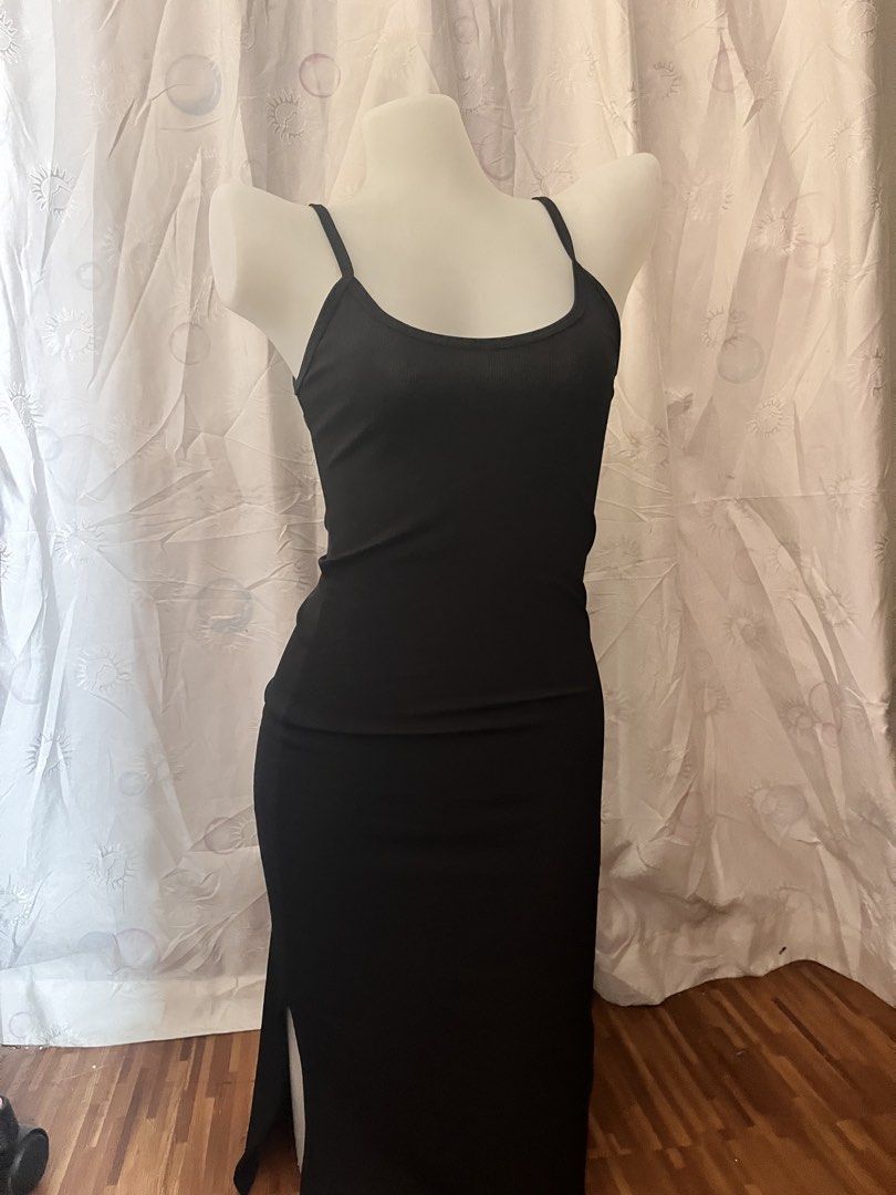 Black Ribbed Spaghetti Strap Maxi Dress with Slit (Category: Dresses) located in Manila. Submitted by chimcheese (Listing ID 1461584812, Image 1). Description: - Black ribbed maxi dress - Thin spaghetti straps - Flattering fitted silhouette - High side slit for easy movement and style - Perfect for dressing up or down - A versatile addition to any wardrobe.