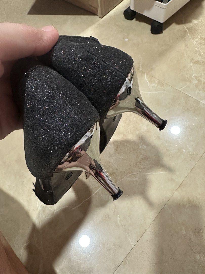 Black Stilleto Shoes (Category: Heels) located in Caloocan City. Submitted by lavenshaven (Listing ID 1461704821, Image 3). Description: -Black Formal/ Evening Shoes - With Glitter effect. Perfect for wedding or formal events - Natatanggal yung ibang part pero pwede iglue. (ganyan na sya kahit nung nabili ko) - Nagbabalat yung part ng pang hook - Occassional lang nagagamit -No box - Size 37 - Brand : SUKI - Location: North Caloocan.
