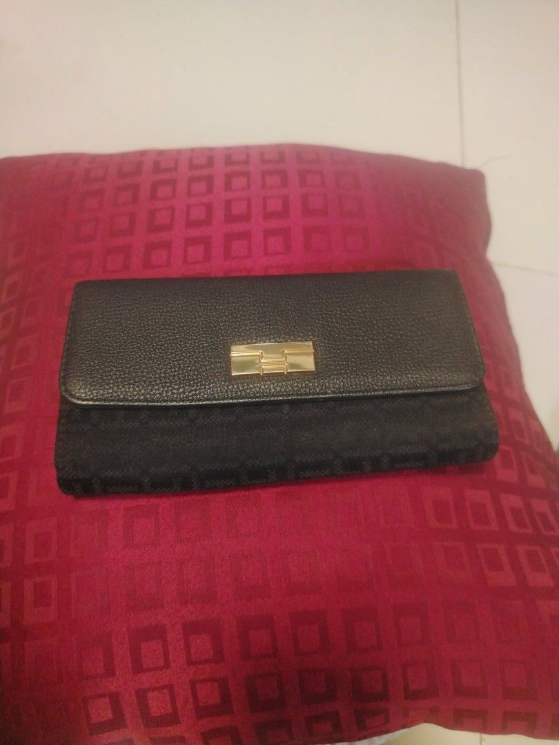 Black Textured Long Wallet with Gold Clasp (Category: Wallets & Card holders) located in Manila. Submitted by wildwind_73f77a (Listing ID 1461640427, Image 1). Description: - Chic black long wallet - Textured exterior with a smooth flap - Secure gold clasp closure - Multiple interior card slots and compartments - Spacious enough for all your essentials - Versatile for everyday or special occasions.