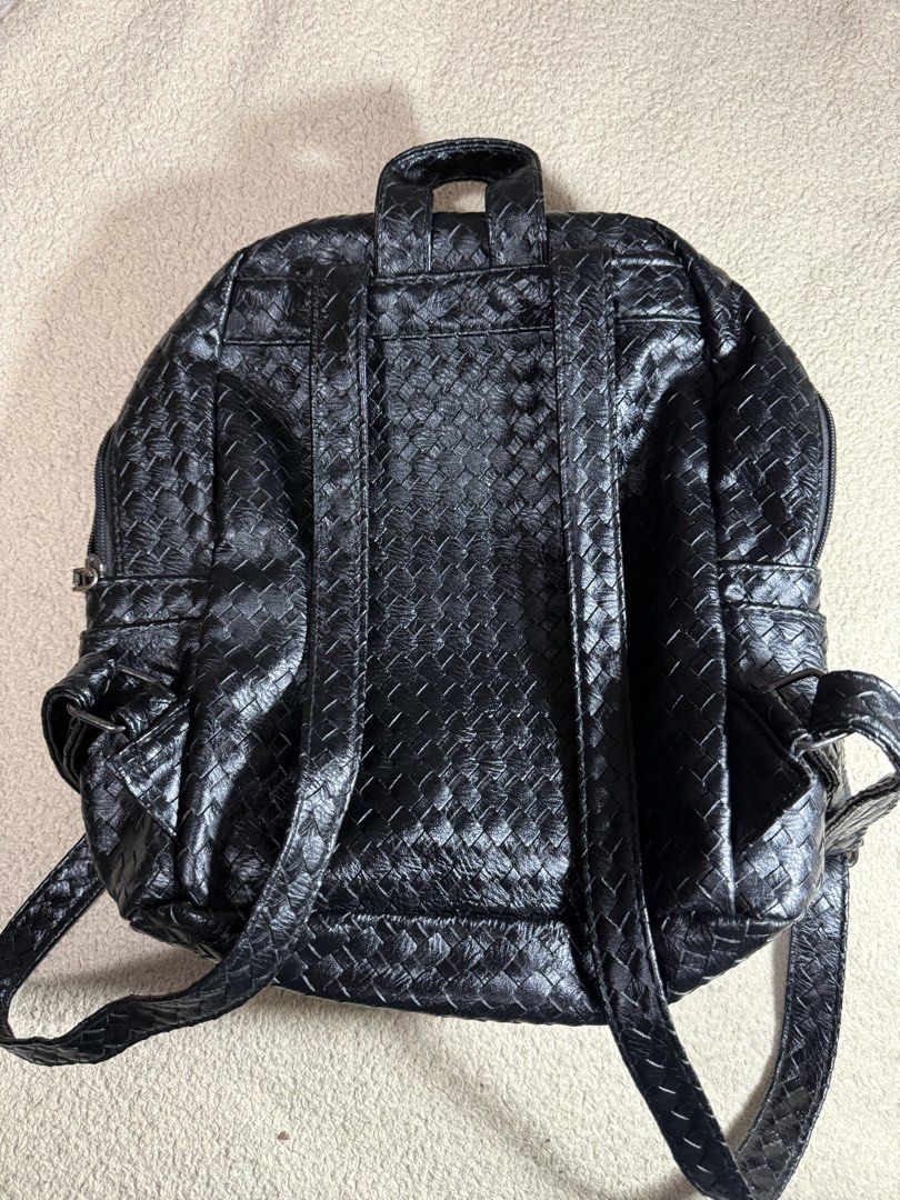 Black Woven Backpack with Hexagonal Studs (Category: Backpacks) located in Manila. Submitted by paulseller009 (Listing ID 1461747309, Image 2). Description: - Stylish black backpack with a unique woven texture. - Decorated with eye-catching shiny hexagonal studs on the front. - Includes a convenient front zip pocket for quick access. - Spacious main compartment for all your essentials. - Adjustable straps ensure a comfortable fit for everyone. - 