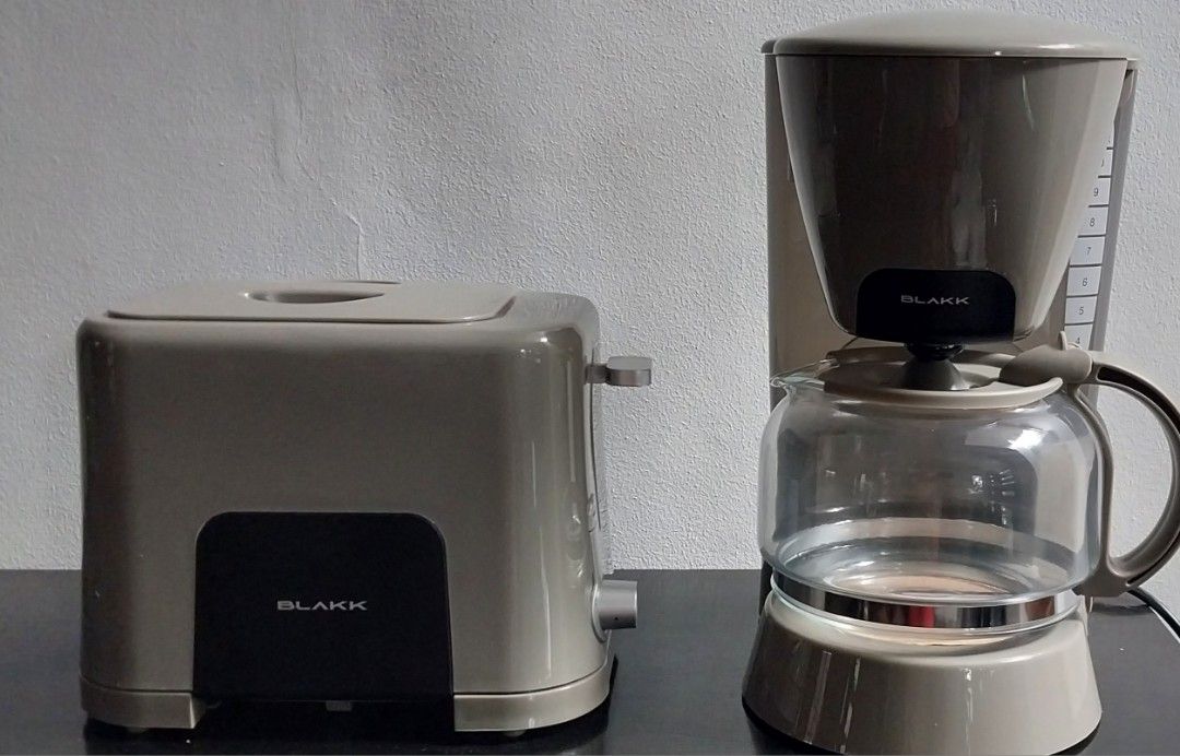 BLAKK Breakfast Set Coffee Maker & 2-Slice Pop-Up Toaster (Category: Ovens & Toasters) located in Quezon City. Submitted by yellowapril (Listing ID 1461582864, Image 2). Description: - BLAKK Breakfast Set: Coffee Maker & 2-Slice Toaster - Coffee Maker: 1.25L capacity (10-12 cups), overheat protection, washable filter, water level indicator - Toaster: Electronic browning control, center-lift lever - User manuals included for both appliances.