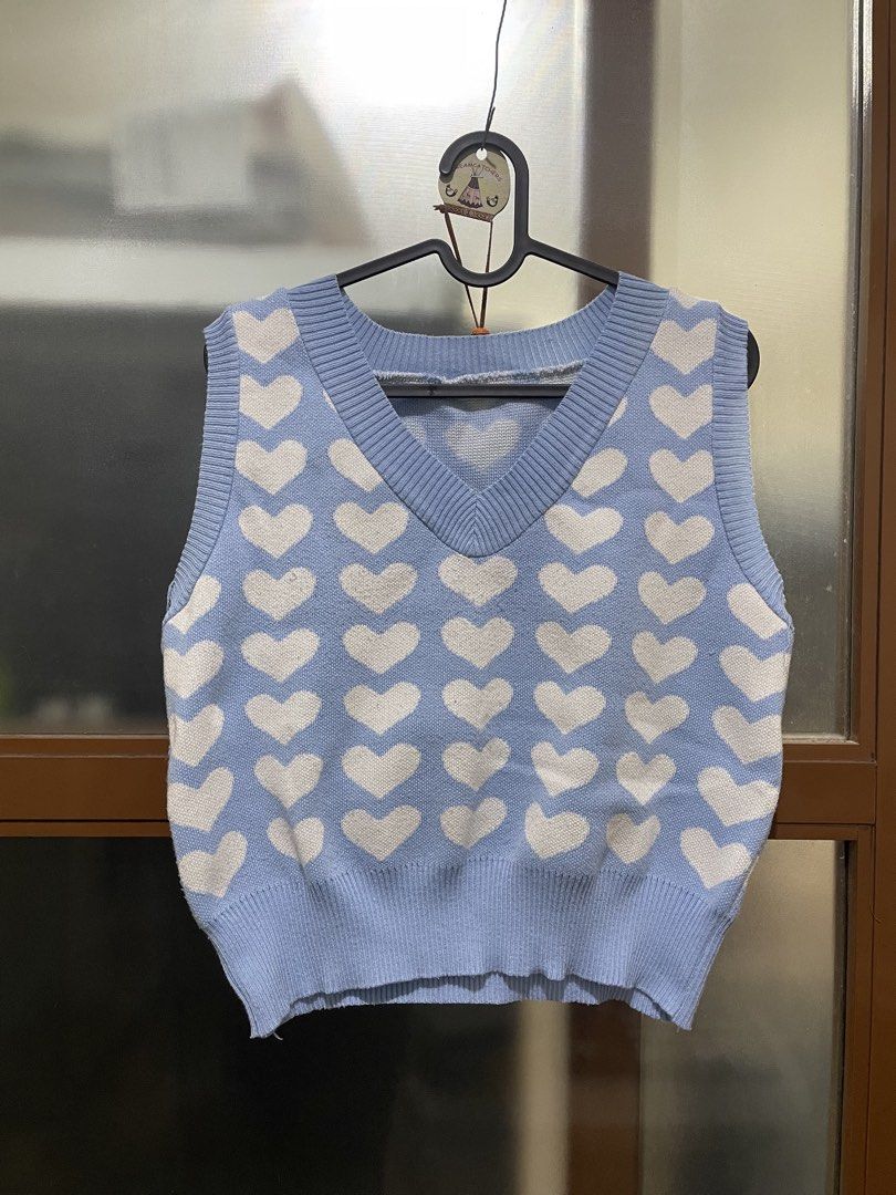 Blue Heart Pattern Knit Vest Freesize (M-Semi XL) (Category: Sleeveless) located in Manila. Submitted by erin.iah (Listing ID 1461651185, Image 1). Description: Heart Pattern Blue Knitted Vest Freesize, fits M-Semi XL Bought back a few years ago. No stains. Pm if interested!.