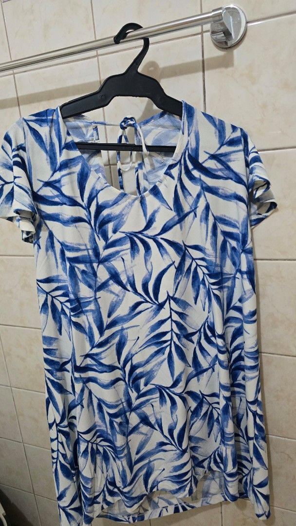 Blue Leaf Print Dress with Tie Back (Category: Dresses) located in Quezon City. Submitted by viviandbarranda (Listing ID 1461639033, Image 1). Description: - Adorable blue and white leaf print dress - Features cute flutter sleeves - Adjustable tie-back detail at the shoulders - Made from lightweight fabric, ideal for hot weather - Effortless to wear and style for any occasion.