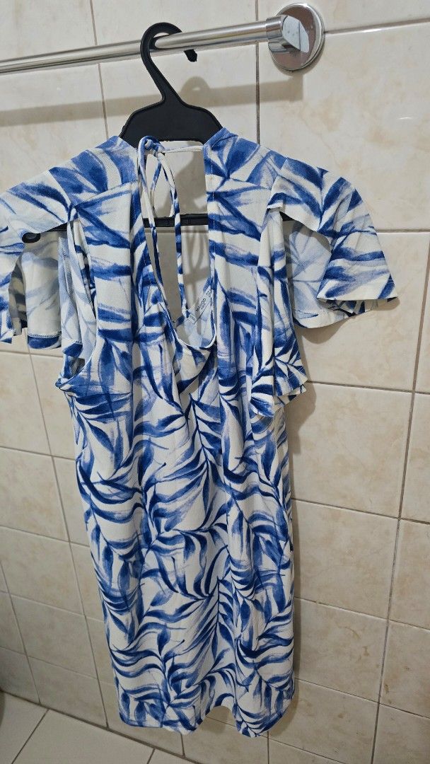 Blue Leaf Print Dress with Tie Back (Category: Dresses) located in Quezon City. Submitted by viviandbarranda (Listing ID 1461639033, Image 2). Description: - Adorable blue and white leaf print dress - Features cute flutter sleeves - Adjustable tie-back detail at the shoulders - Made from lightweight fabric, ideal for hot weather - Effortless to wear and style for any occasion.