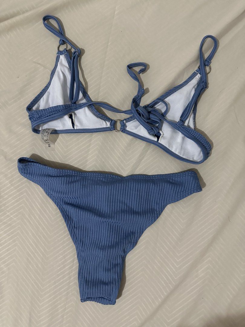 Blue Ribbed Bikini Set with Ring Details (Category: Bikinis & Swimsuits) located in Lipa City. Submitted by chiechums (Listing ID 1461568980, Image 2). Description: - Blue ribbed bikini set - Triangle top with adjustable straps and tie-back - Bottoms feature side ring details - Comfortable and stylish for beach days or pool parties.