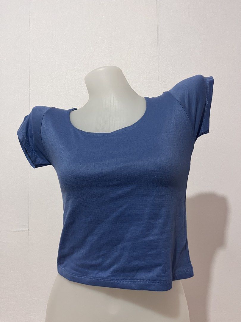 Blue Short Sleeve Crop Top (Category: Others Tops) located in Manila. Submitted by chimcheese (Listing ID 1461583398, Image 1). Description: - Simple blue crop top - Short sleeves - Round neckline - Fabric with a slight sheen - Comfortable for everyday wear - Ideal for layering or wearing solo - Pairs well with high-waisted bottoms.