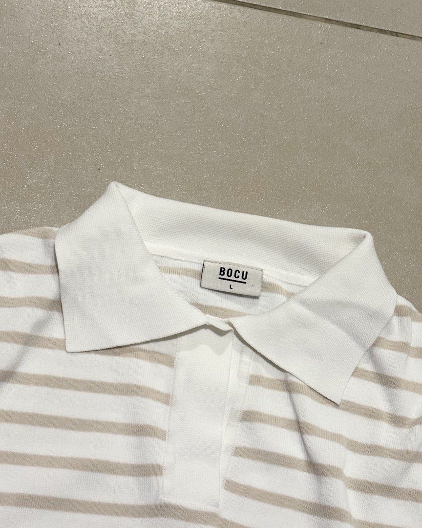 Bocu Stripe Tucked Sleeve Polo (Category: Others Tops) located in Manila. Submitted by _maisonseconde (Listing ID 1461696190, Image 2). Description: Bocu Stripe Tucked Sleeve Polo - Knitted Polo in Sand and White Stripes - worn only two times Size : Large MOP - BP1/Shope3Pay MOD - same day delivery (based fr Pasay) Message for Inquiries :) .
