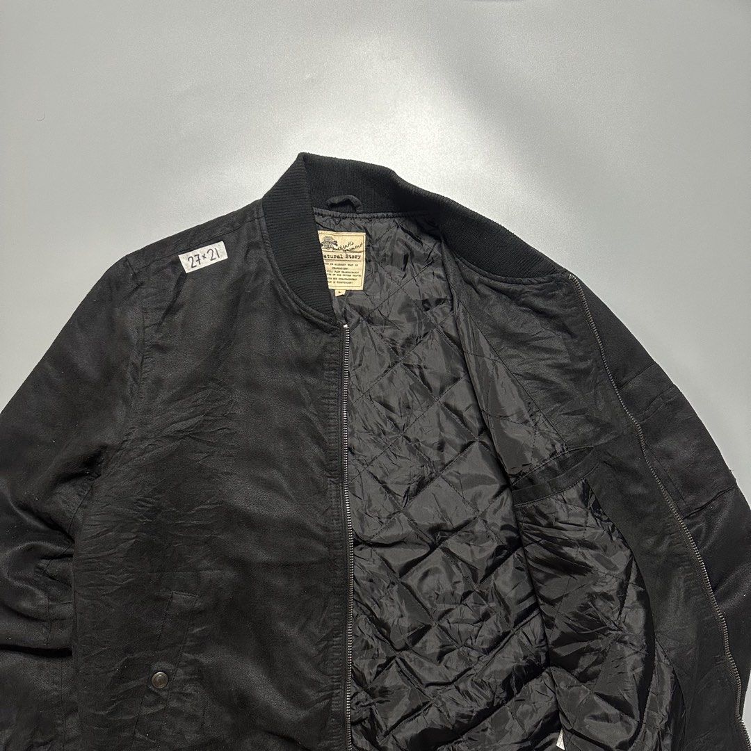 Bomber Jacket (Category: Coats, Jackets and Outerwear) located in Baguio. Submitted by subaitems (Listing ID 1461642982, Image 2). Description: - Black bomber jacket by Natural Story - Quilted lining for extra warmth - Zip-up front closure - Two side pockets - Zippered pocket on the sleeve - Ribbed collar, cuffs, and hem - Ideal for everyday casual wear.