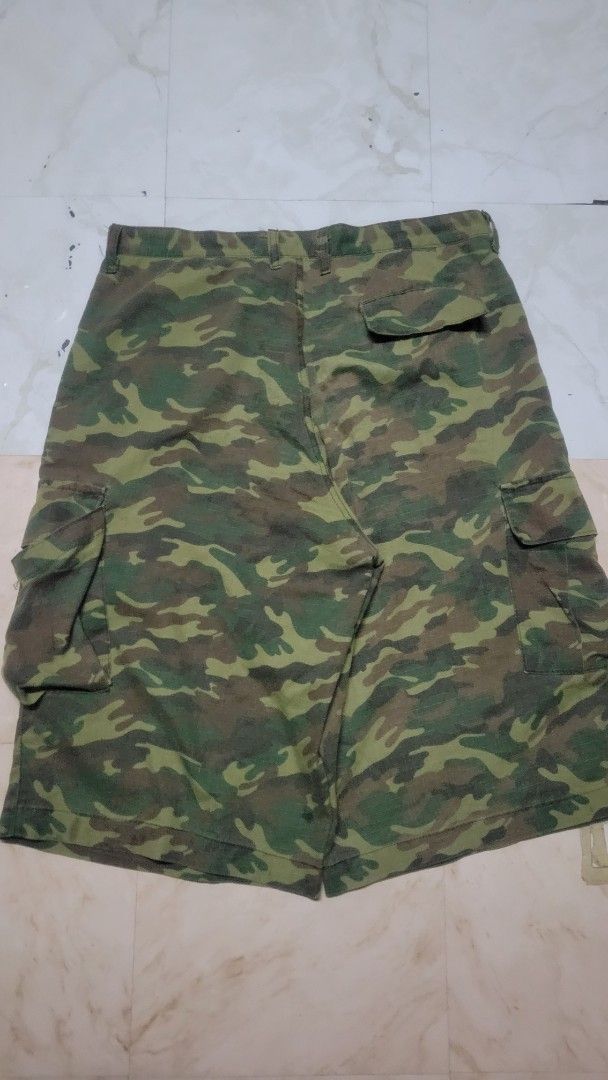 BOSS Camouflage Cargo Shorts (Category: Shorts) located in Manila. Submitted by lamawpaul (Listing ID 1461794394, Image 1). Description: - Authentic BOSS camouflage cargo shorts - Classic green and brown camo pattern - Features multiple functional pockets for ample storage - Secure button and zip fly closure - Ideal for everyday casual wear and outdoor activities.