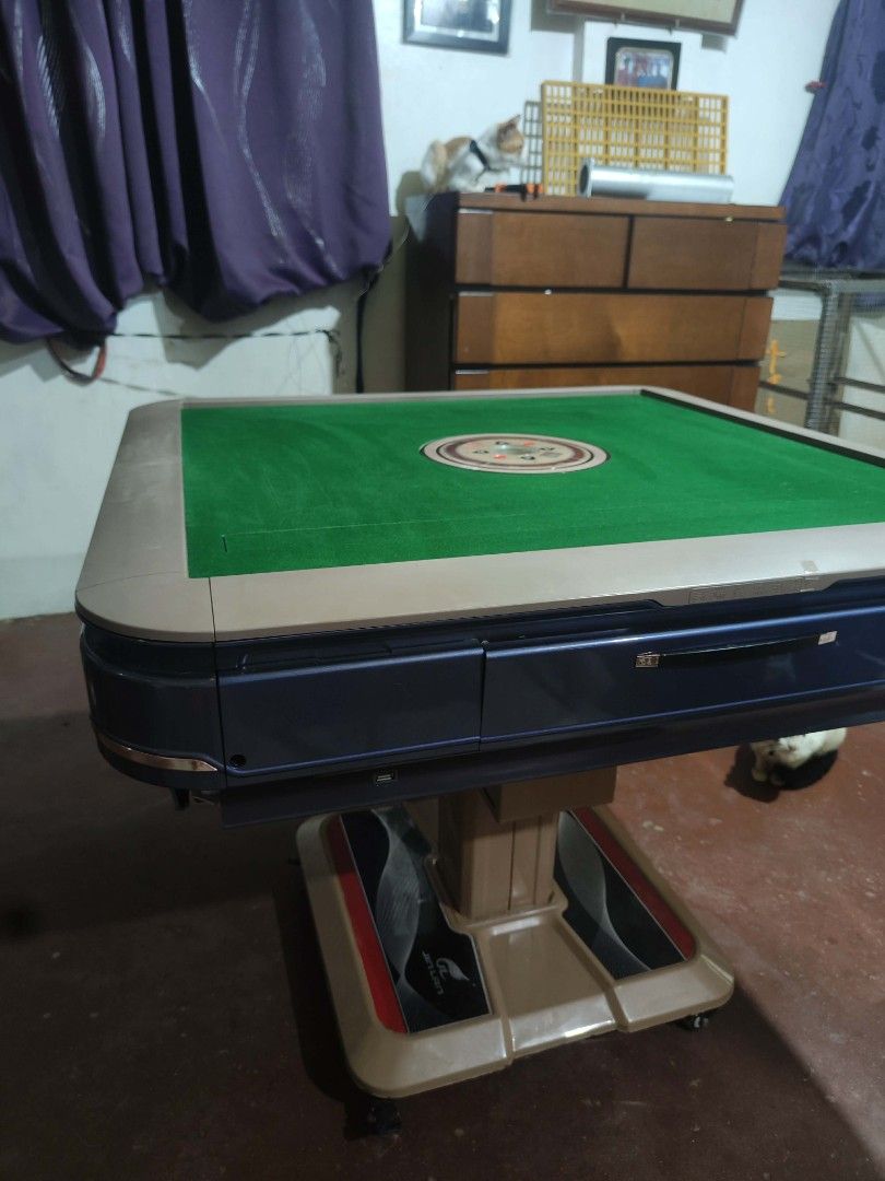 Brand New Condition Automatic Mahjong Table (Category: Tables & Sets) located in Antipolo. Submitted by rrdatario (Listing ID 1461695166, Image 2). Description: Automatic Mahjong Table (Foldable) - 144 pcs tiles, 44 mm size - 9 months used - 2 sets tiles, blue and green Location: Antipolo, Rizal Price: 23k.