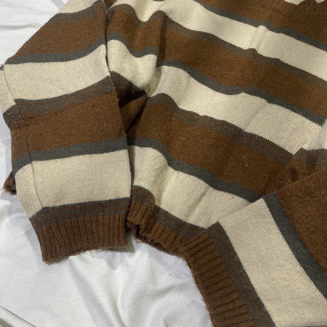 Brown Cream Striped Knit Sweater (Category: Coats, Jackets and Outerwear) located in Rizal. Submitted by lili.s.choyce (Listing ID 1461724857, Image 3). Description: - Cozy knit sweater - Best fit: S-Semi L - Classic horizontal stripes in brown, cream - Long sleeves with ribbed cuffs - Comfortable crew neckline - Ideal for layering or standalone wear - Soft and comfortable material.