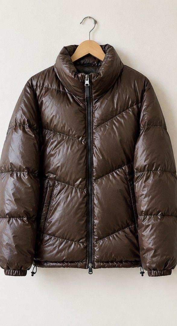 Brown Shiny Puffer Jacket (Category: Coats, Jackets and Outerwear) located in Bulacan. Submitted by Domozz (Listing ID 1461677535, Image 1). Description: - Super warm and shiny brown puffer jacket - High collar for wind protection - Zipper closure - Elasticated cuffs and hem - Ideal for cold weather - Stylish and flattering fit.
