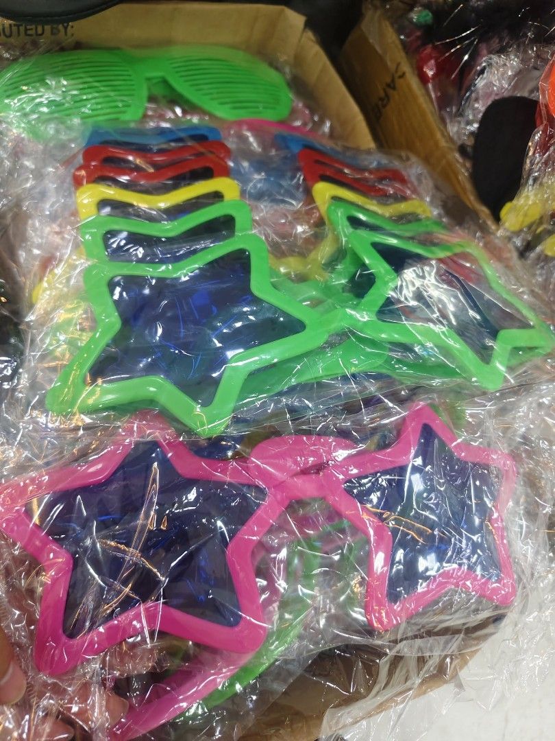 Bulk Pack Fun Novelty Sunglasses for Parties & Events (Category: Sunglasses & Eyewear) located in Manila. Submitted by neojamesca55018 (Listing ID 1461617365, Image 2). Description: - Assorted fun novelty sunglasses - Great for parties, events, or just for fun - Features various shapes (star, heart, shutter shades, etc.) and bright colors - Each pair is individually wrapped - Perfect for goodie bags and party favors.