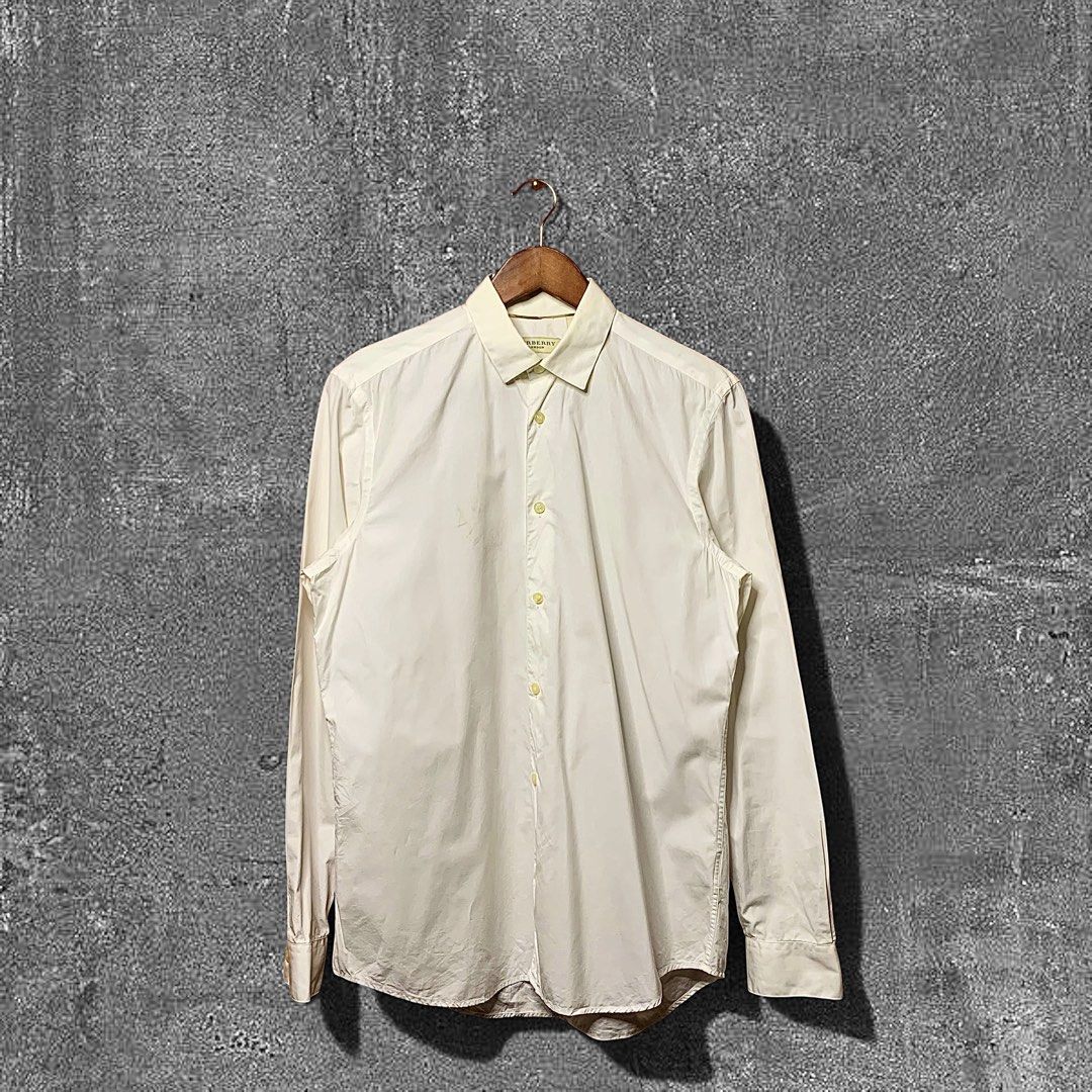 Burberry London Button down (Category: Formal Shirts) located in Quezon City. Submitted by donklasiko (Listing ID 1461567459, Image 1). Description: Condition: 9.5+/10 Pristine condition Issue: non Refer to the dimension 🤗 PM FOR MORE DETAILS NO RETURN, NO EXCHANGE & NO REFUND! ✅I ALSO ACCEPT TRADE/SWAP TO ANYTHING JUST DROP YOUR OFFER Please manage your expectations, this is a secondhand item. What you see is what you get 😊 💵MOP: GCASH, BDO o