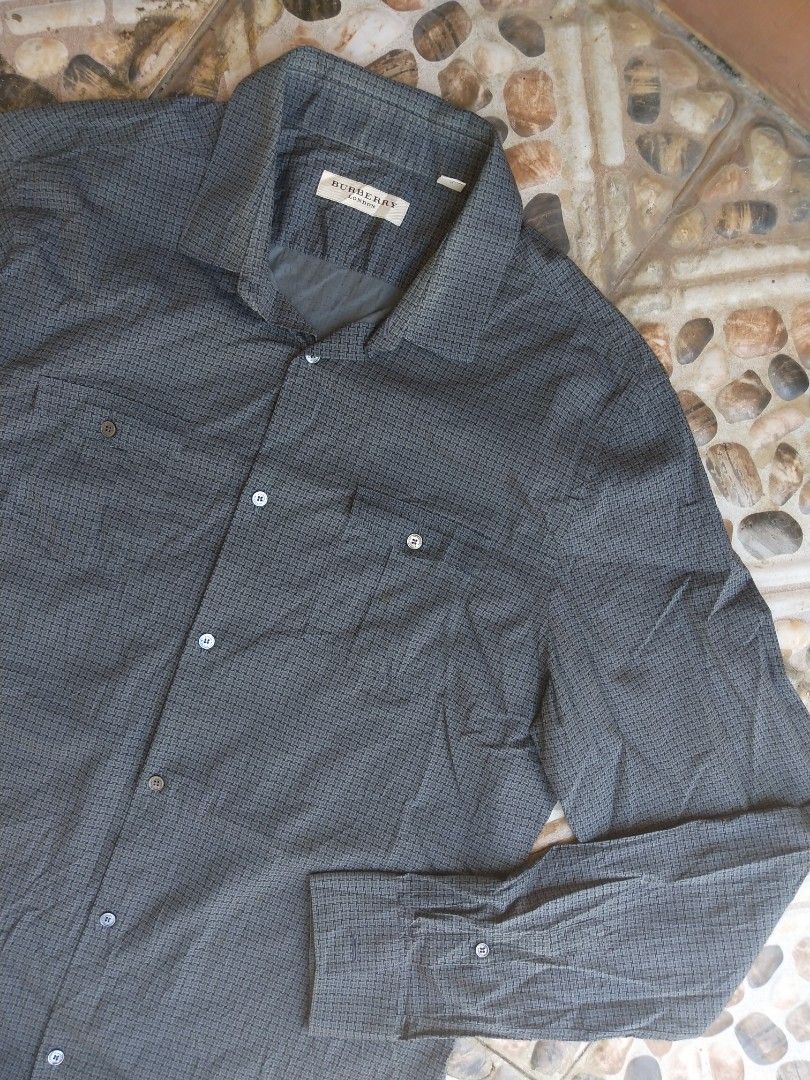 Burberry Long- sleeve (Category: Tshirts & Polo Shirts ) located in Manila. Submitted by dodengricafort (Listing ID 1461581435, Image 2). Description: Burberry Long-sleeve Button-up Men's sport Shirts. Color. Dark Gray or Charcoal Grid Micro-check Pattern. Size Large Dimension. Width 22 Length 29.5 - 31 Color rate 9.8/10 Excellent condition Need wash only Direct Message📨 Molino Bacoor Cavite📍.