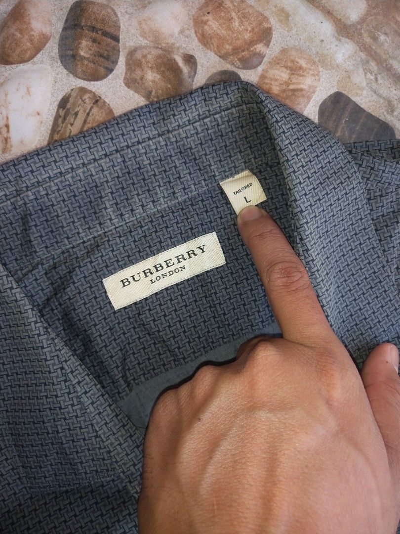 Burberry Long- sleeve (Category: Tshirts & Polo Shirts ) located in Manila. Submitted by dodengricafort (Listing ID 1461581435, Image 3). Description: Burberry Long-sleeve Button-up Men's sport Shirts. Color. Dark Gray or Charcoal Grid Micro-check Pattern. Size Large Dimension. Width 22 Length 29.5 - 31 Color rate 9.8/10 Excellent condition Need wash only Direct Message📨 Molino Bacoor Cavite📍.
