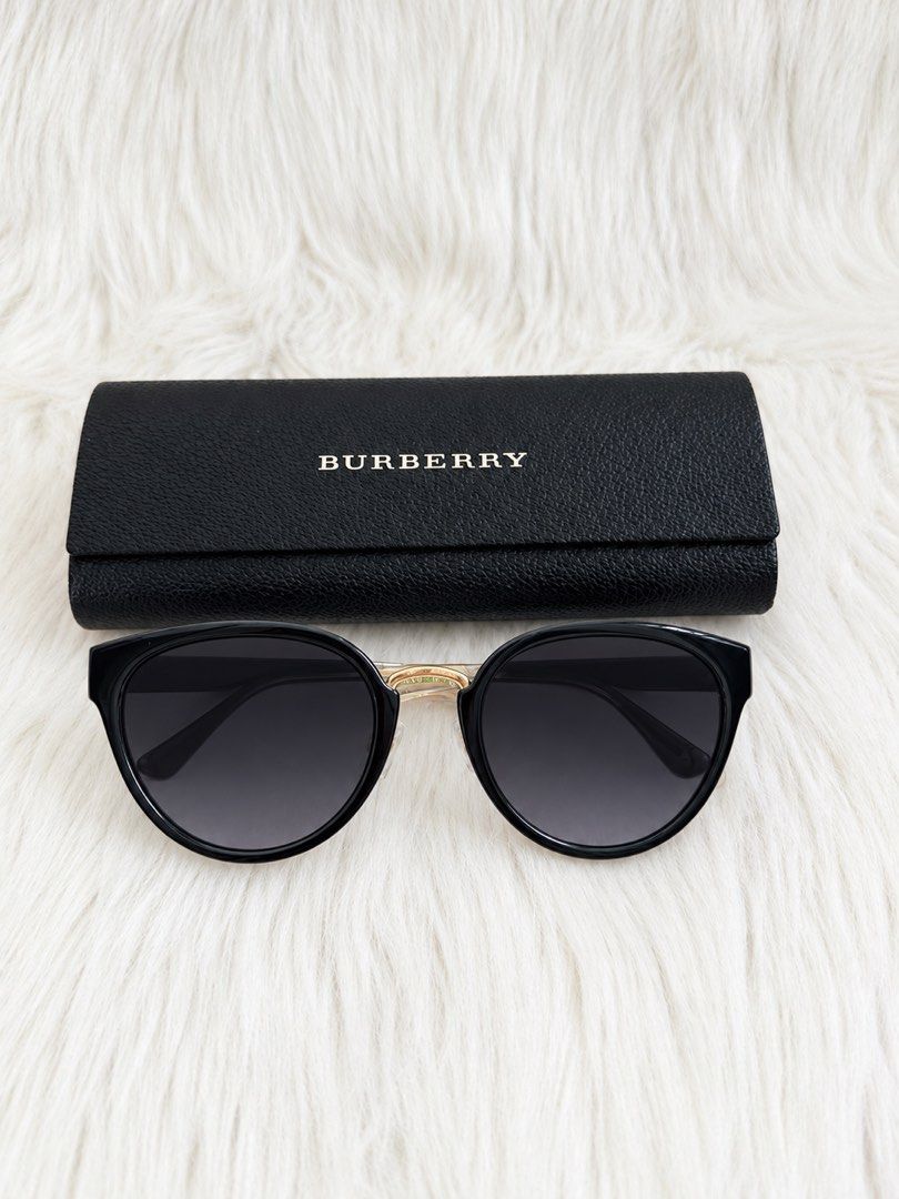 Burberry Sunglasses with Case (Category: Sunglasses & Eyewear) located in Cainta. Submitted by mskath__ (Listing ID 1461656854, Image 1). Description: - Authentic Burberry sunglasses - Classic black frames with elegant gold accents - Gradient lenses for stylish sun protection - Comes with original Burberry case - Ideal for sunny weather.