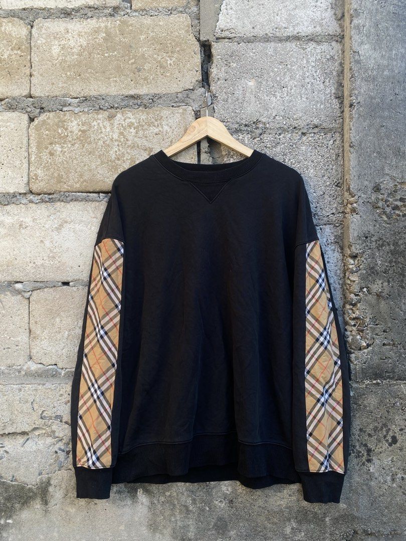 Burberry Sweater Crewneck (Category: Coats, Jackets and Outerwear) located in Candaba. Submitted by dejesus.bench17 (Listing ID 1461792930, Image 1). Description: Burberry Checkered Sleeve Crewneck -Color: Black -Condition: Excellent -Color rate: 8.5/10 -Issue: have 1 baby pinhole (back shoulder) -Dimes: W24 L28 -Price: 750 + ship.