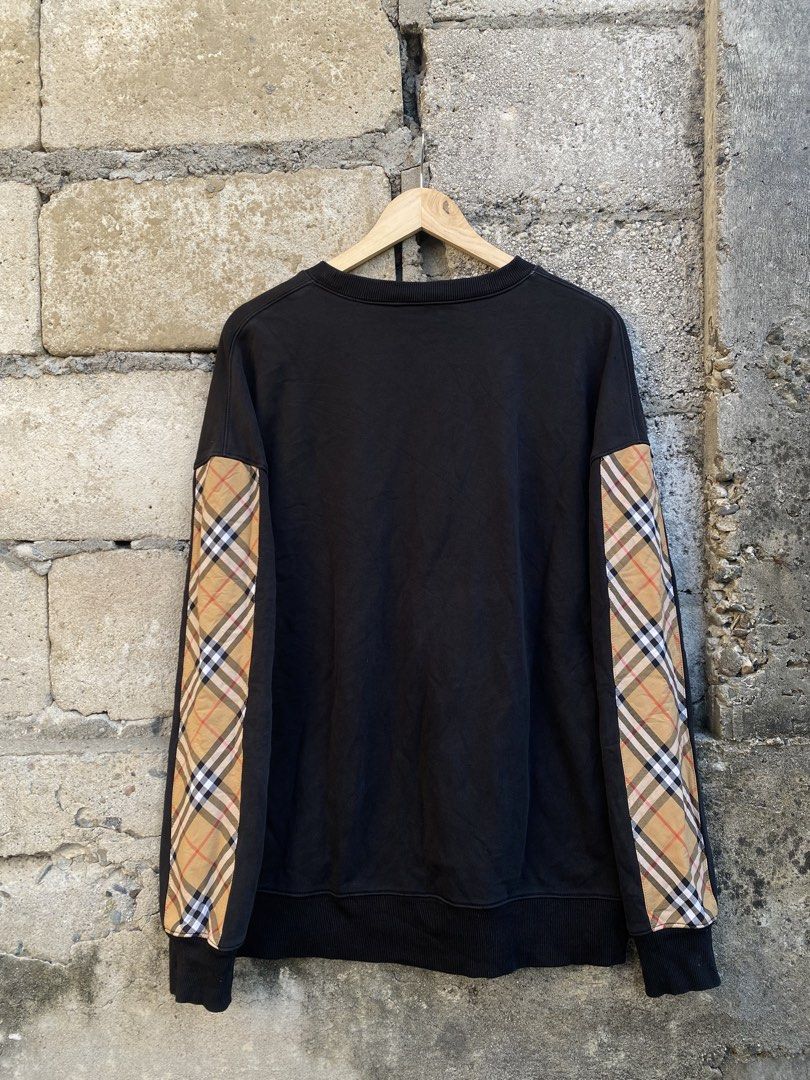 Burberry Sweater Crewneck (Category: Coats, Jackets and Outerwear) located in Candaba. Submitted by dejesus.bench17 (Listing ID 1461792930, Image 2). Description: Burberry Checkered Sleeve Crewneck -Color: Black -Condition: Excellent -Color rate: 8.5/10 -Issue: have 1 baby pinhole (back shoulder) -Dimes: W24 L28 -Price: 750 + ship.