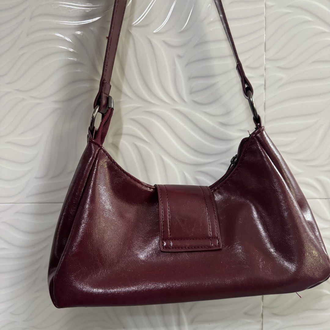 Burgundy Shoulder Bag (Category: Shoulder Bags) located in Cagayan de Oro. Submitted by kheyx (Listing ID 1461606755, Image 3). Description: - Cute burgundy shoulder bag - Features a stylish buckle detail on the front keychains NOT included - Secure zipper closure - Adjustable strap for comfortable wear - Ideal for everyday use.