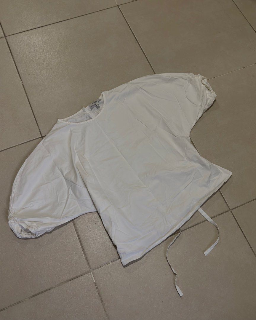 COS Belted Puff-Sleeve Blouse (Category: Blouses) located in Manila. Submitted by _maisonseconde (Listing ID 1461691457, Image 1). Description: C0S Belted Puff-Sleeve Blouse gathered puffed sleeves delicate ties to highlight the waist 100% organic cotton Size - Eur 34 MOP - BP1/Shope3Pay MOD - same day delivery (based fr Pasay) Message for Inquiries :) .