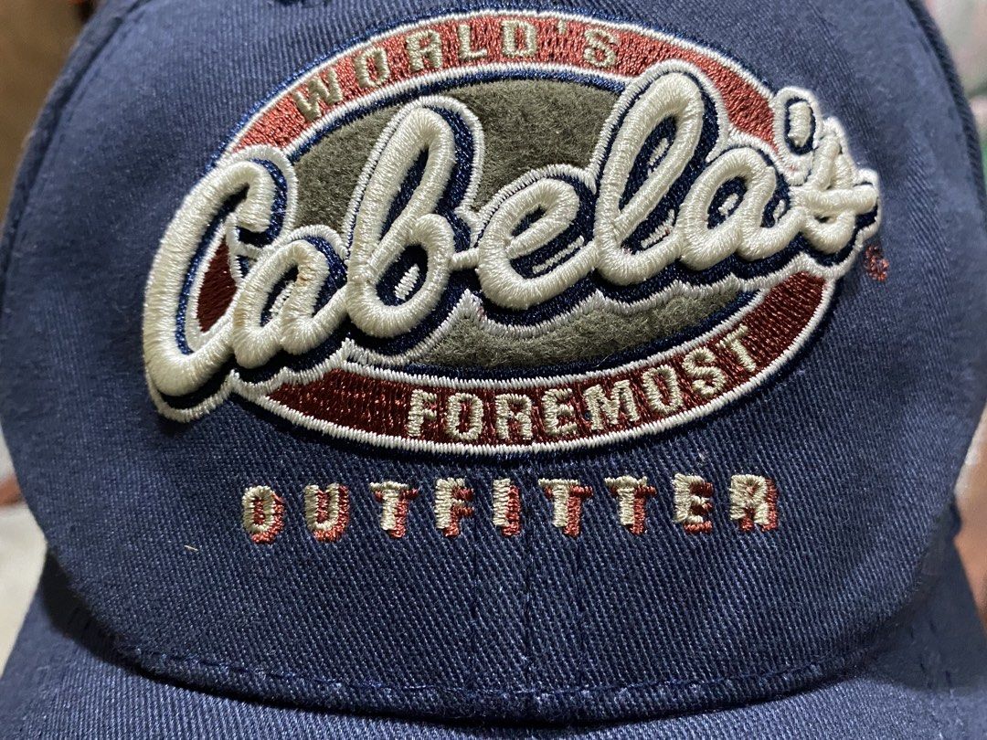 CABELA'S WORLD'S FOREMOST OUTFITTER CAP (Category: Caps & Hats) located in Binmaley. Submitted by vanilla_style (Listing ID 1461741861, Image 2). Description: • Authentic Cabela’s — USA outdoor brand 🇺🇸 • Color: Navy Blue + Rust Orange brim • Adjustable brass buckle strap — fits all head sizes • Embroidered logo — classic vintage style • Clean condition — no holes/stains.