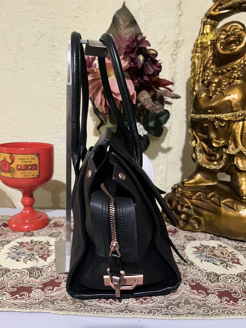 Calvin Klein Black Leather Tote Bag (Category: Tote Bags) located in Manila. Submitted by deltaechoshop (Listing ID 1461566676, Image 3). Description: - Brand: Calvin Klein - Material: Black Leather - Closure: Zip - Handles: Top handles - Hardware: Rose gold details - Features: Spacious interior - Ideal for: Everyday use, work.