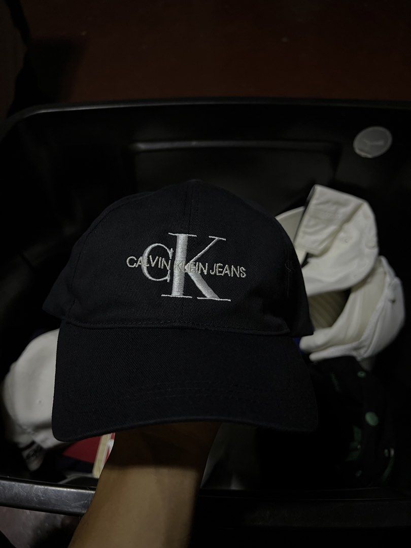 Calvin Klein Jeans Black Cap OS (Category: Caps & Hats) located in Davao. Submitted by dubdabi.co (Listing ID 1461780478, Image 1). Description: - Classic black Calvin Klein Jeans cap - Features iconic CK Jeans logo embroidery on the front - Adjustable snapback closure for a personalized fit - One size fits most - Made in Taiwan.
