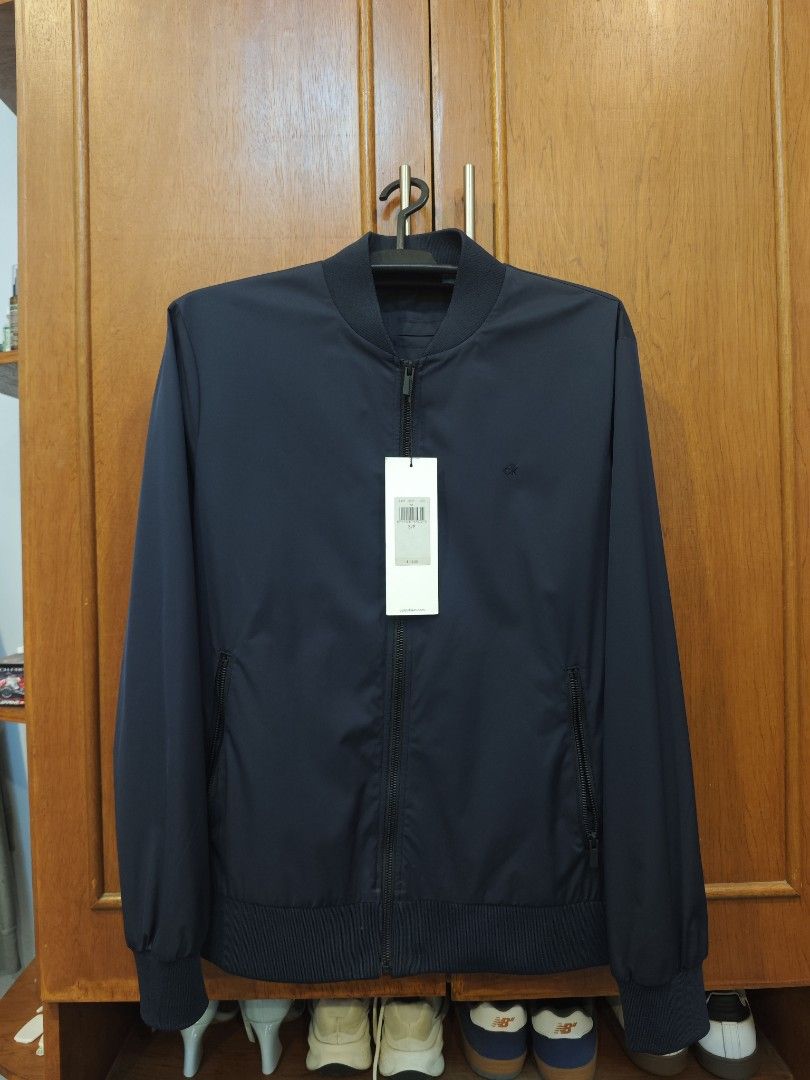 Calvin Klein Lightweight Jacket (Category: Coats, Jackets and Outerwear) located in Santa Rosa. Submitted by ace.17 (Listing ID 1461734402, Image 2). Description: Black – Size S/P – Brand New with Tags Dimension: 22x25.