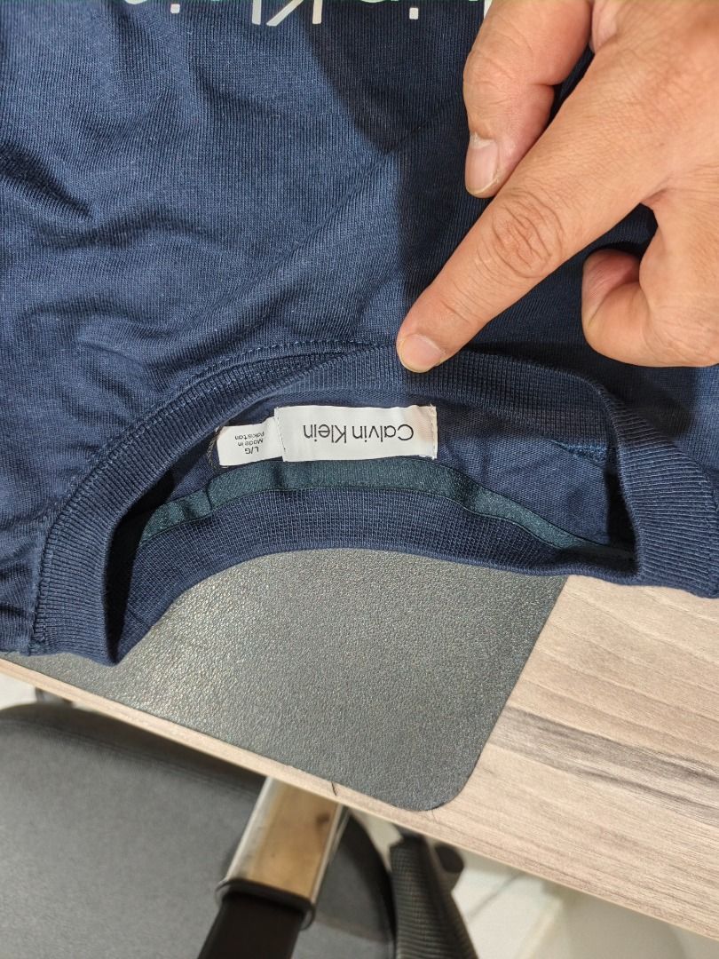 Calvin Klein Navy Blue T-Shirt (Category: Shirts) located in Caloocan City. Submitted by purefalcon.974eee (Listing ID 1461606602, Image 2). Description: - Brand new navy blue Calvin Klein t-shirt - Features a simple, classic logo on the front - Classic fit, perfect for everyday wear - Still has original tags attached - A versatile staple piece that can be styled up or down.