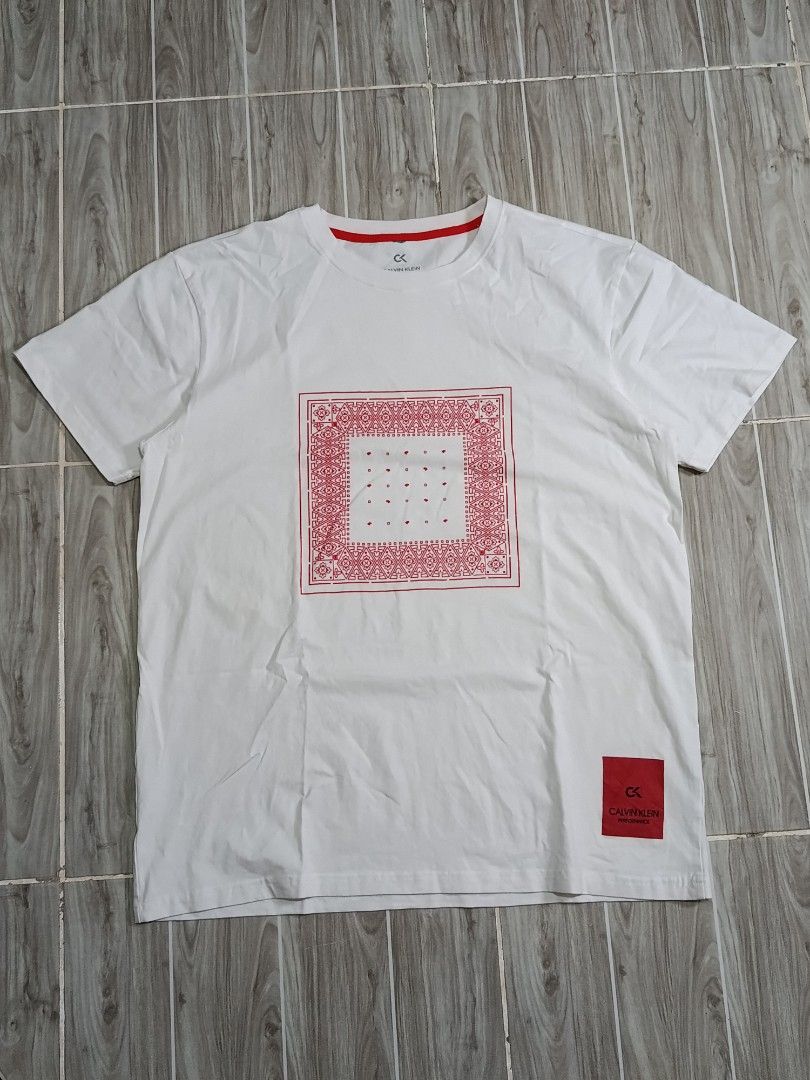 CALVIN KLEIN PERFORMANCE DRIFIT TSHIRT (freeshipping) (Category: Activewear) located in Quezon City. Submitted by gyl-stop (Listing ID 1461584817, Image 1). Description: free shipping 21.5 x 28 very good condi cr: 9.5/10 issue: nag bleed Yung red part sa bandang batok.