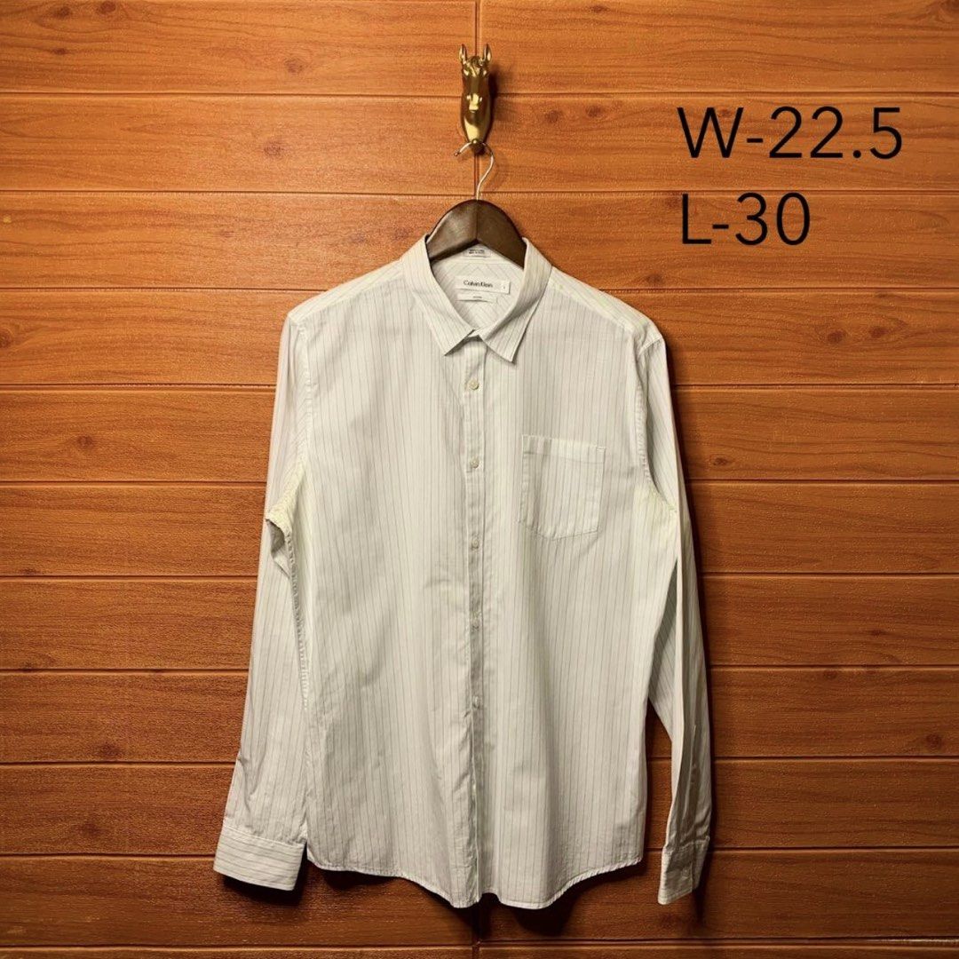 Calvin Klein Striped Button down (Category: Formal Shirts) located in Quezon City. Submitted by donklasiko (Listing ID 1461581269, Image 2). Description: Condition: 9.5+/10 Pristine condition Issue: non Refer to the dimension 🤗 PM FOR MORE DETAILS NO RETURN, NO EXCHANGE & NO REFUND! ✅I ALSO ACCEPT TRADE/SWAP TO ANYTHING JUST DROP YOUR OFFER Please manage your expectations, this is a secondhand item. What you see is what you get 😊 💵MOP: GCASH, 