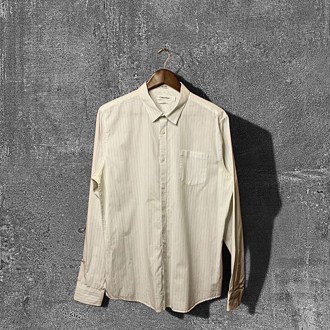 Calvin Klein Striped Button down (Category: Formal Shirts) located in Quezon City. Submitted by donklasiko (Listing ID 1461581269, Image 1). Description: Condition: 9.5+/10 Pristine condition Issue: non Refer to the dimension 🤗 PM FOR MORE DETAILS NO RETURN, NO EXCHANGE & NO REFUND! ✅I ALSO ACCEPT TRADE/SWAP TO ANYTHING JUST DROP YOUR OFFER Please manage your expectations, this is a secondhand item. What you see is what you get 😊 💵MOP: GCASH, 