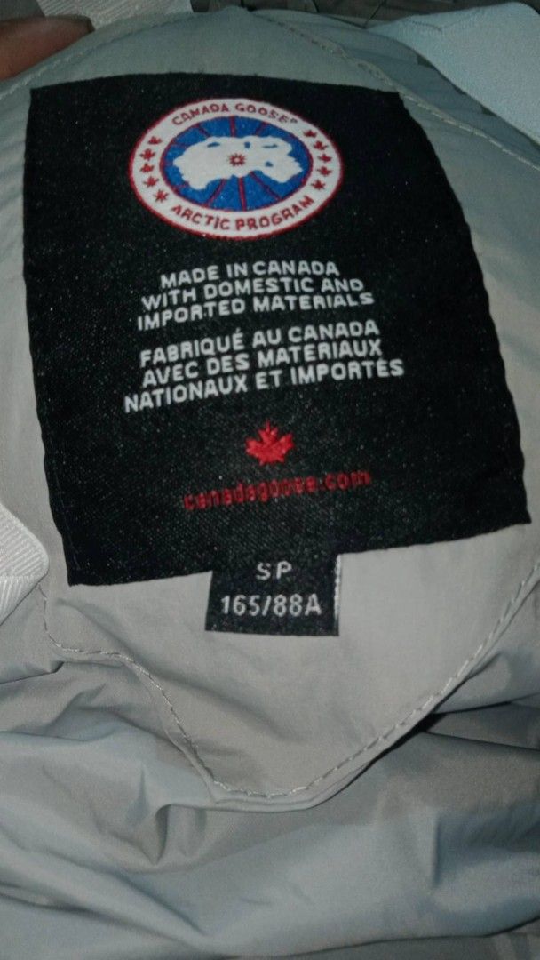 Canada Goose Puffer Jacket - Light Grey - Size S (Category: Coats, Jackets and Outerwear) located in Manila. Submitted by uswalinmay36225 (Listing ID 1461607284, Image 2). Description: - Authentic Canada Goose Puffer Jacket - Color: Light Grey - Made in Canada - Size: S (165/88A) - Hooded design for enhanced warmth - Ideal for cold weather conditions - Please check photos for detailed condition issue:last pic discoloration .