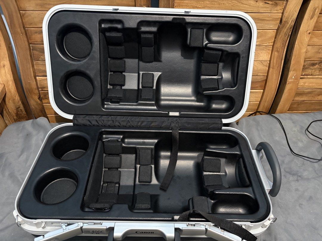 Canon 400C Lens Case (Category: Camera Bags & Carriers) located in Baguio. Submitted by drincaaya (Listing ID 1461675180, Image 1). Description: - Hard shell case designed for Canon lenses - Custom foam inserts for maximum protection - Features a sturdy handle for easy carrying - Secure latches ensure safe closure - Exterior shows minor scuffs from normal use - Interior is clean and well-padded - Ideal for transporting and safeguarding valuable c