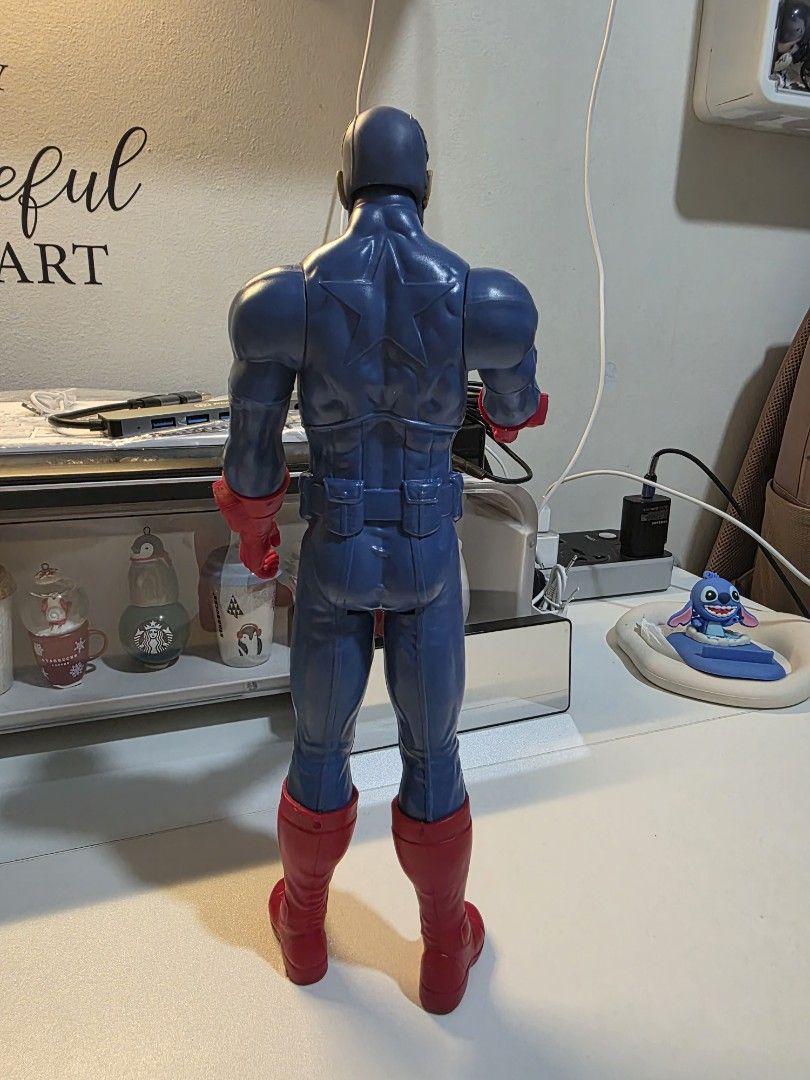 Captain America Action Figure Toy (Category: Figurines & Statues) located in Quezon City. Submitted by hotpinkstylishgirl (Listing ID 1461604688, Image 3). Description: - Iconic Captain America action figure - Classic blue suit with red accents and white star on chest - Approximately 12 inches tall - Fully poseable for dynamic display or active play - Perfect for any Marvel fan - Please note: No accessories are included.