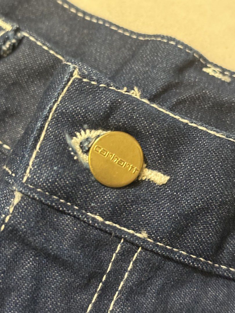 Carhartt Blue Denim Work Pants (Category: Jeans) located in San Fernando. Submitted by passaloadsarisaristore (Listing ID 1461622764, Image 2). Description: - Classic blue Carhartt denim work pants - Iconic Carhartt logo patch on back pocket - Durable construction with contrast stitching - Button fly closure - Cuffed hems - Ideal for work or casual wear.