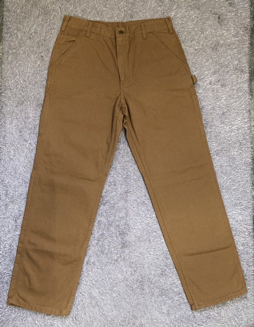 CARHARTT duck utility work pants (Category: Jeans) located in General Santos City (Dadiangas). Submitted by amorhesthrift (Listing ID 1461632952, Image 1). Description: Bought sa 🇺🇸 Di kasya kay partner,benta na lang kaysa ma tambak lang🥹 Size and details na sa picture na po These brown cotton duck utility work pants feature the iconic Carhartt stitched logo patch on the back pocket.