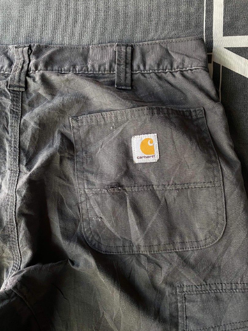 Carhartt Relaxed Fit Cargo Pants (Category: Jeans) located in Manila. Submitted by raymondrob54698 (Listing ID 1461598327, Image 2). Description: - Carhartt Cargo Pants - Relaxed Fit - Dark Grey Color - Durable Workwear Style - Multiple Pockets for Storage - Ideal for everyday wear or work size 36.