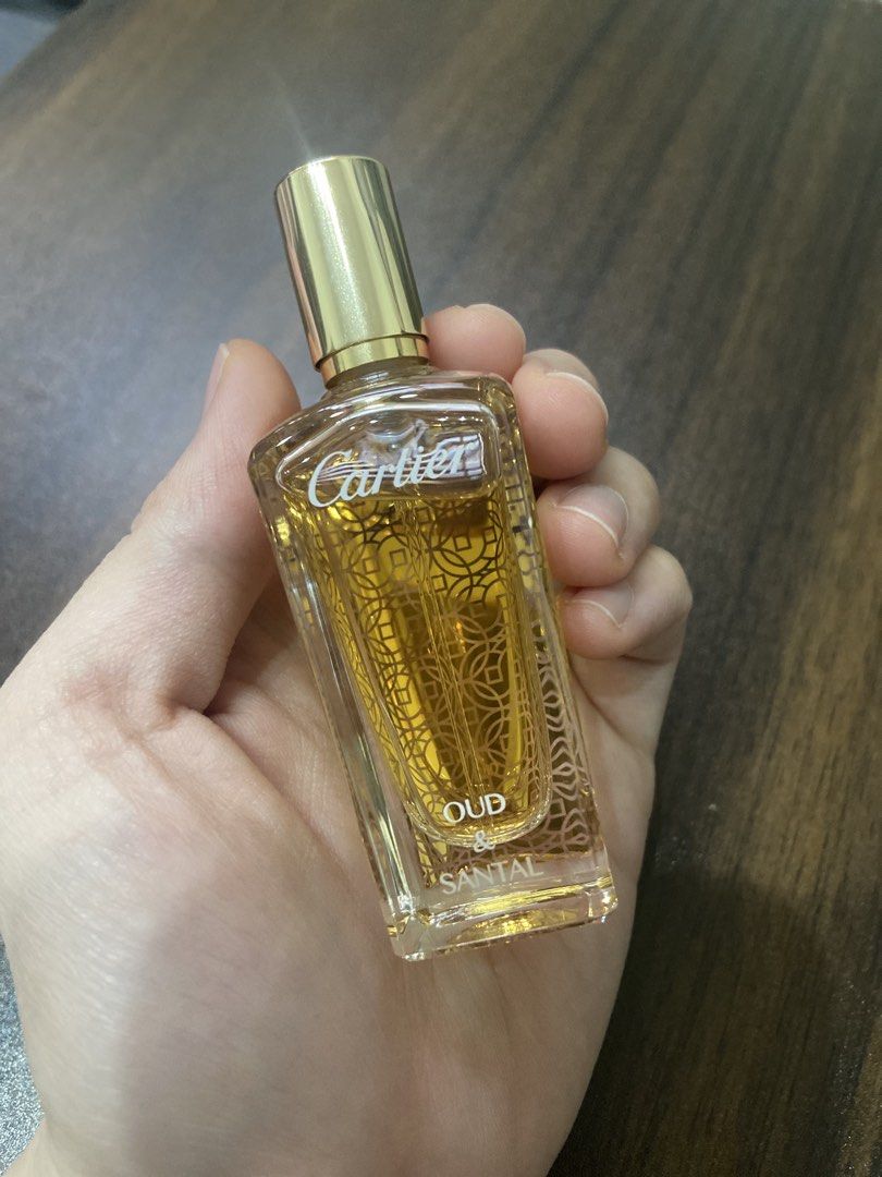 Cartier Oud & Santal Eau de Parfum (Category: Fragrance & Deodorants) located in Makati City. Submitted by pink.velvet (Listing ID 1461578588, Image 2). Description: - Authentic Cartier perfume bottle - Scent: Oud & Santal - Features a luxurious gold cap - Intricate gold detailing on the glass - Beautiful, collectible bottle design - Ideal as a gift - 15ml.