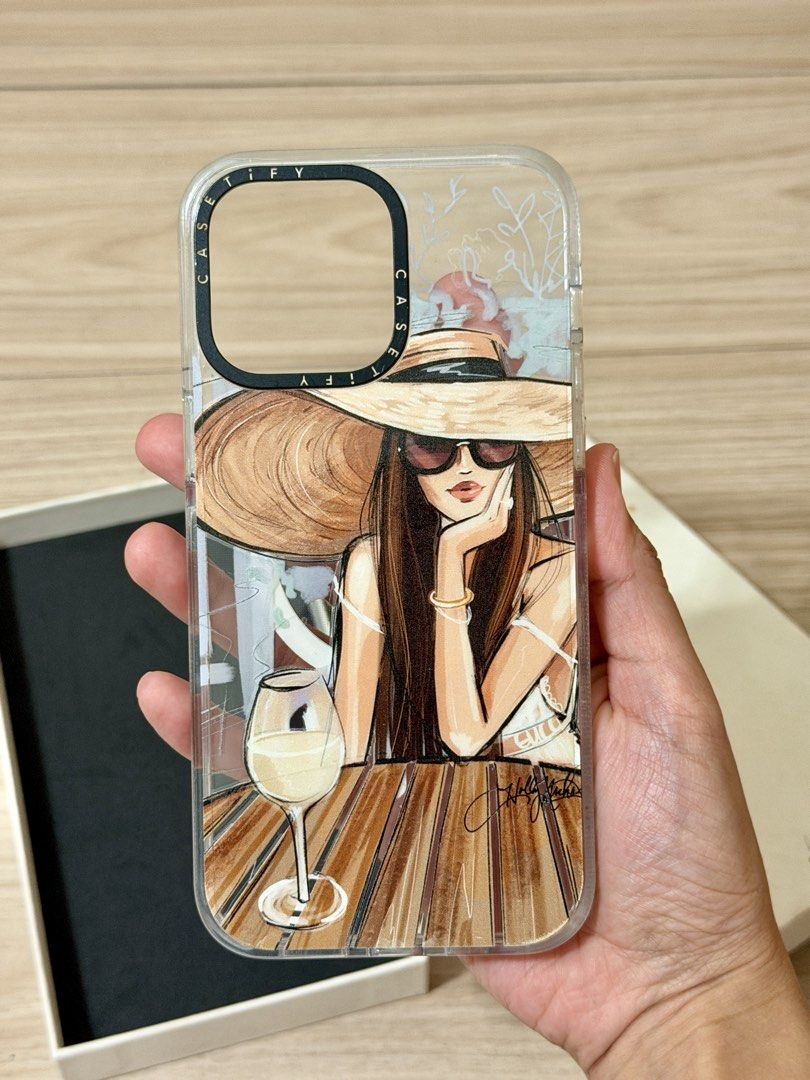 Casetify iPhone 14 Pro Max Case (Category: Cases & Sleeves) located in Manila. Submitted by carad__ (Listing ID 1461724956, Image 2). Description: - Brand: Casetify - Model: iPhone 14 Pro Max - Design: Clear case with a stylish illustration of a woman - Material: Durable, protective material - Condition: Excellent, as shown in photos - Packaging: Comes in original Casetify box.